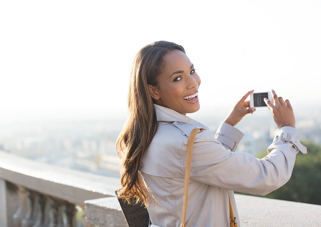 Businesswoman taking pictures