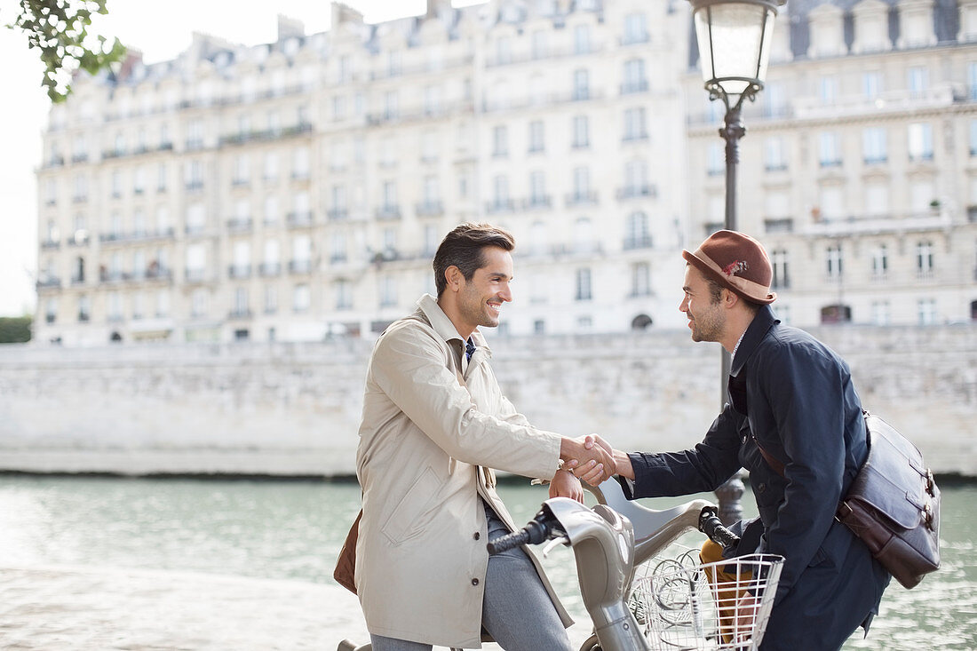 Businessmen handshaking in Paris