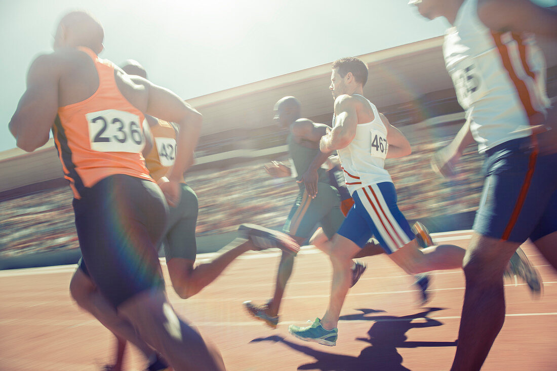 Runners racing on track