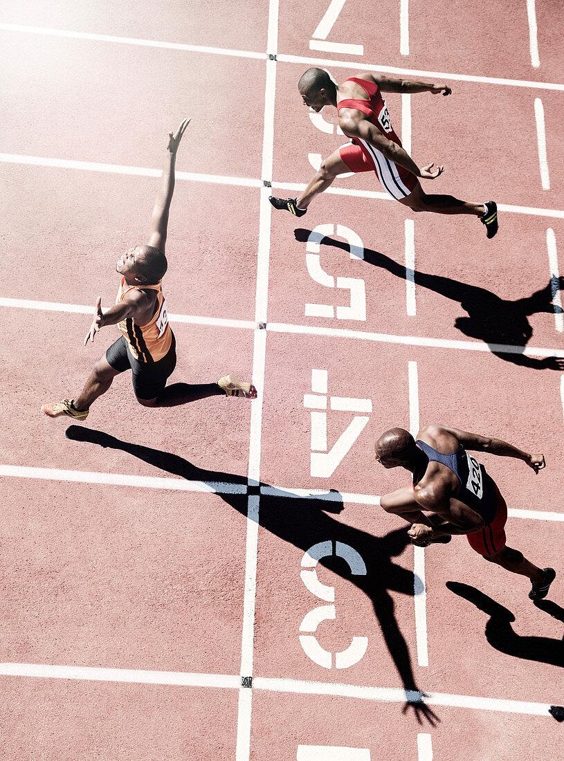 Runners crossing finish line