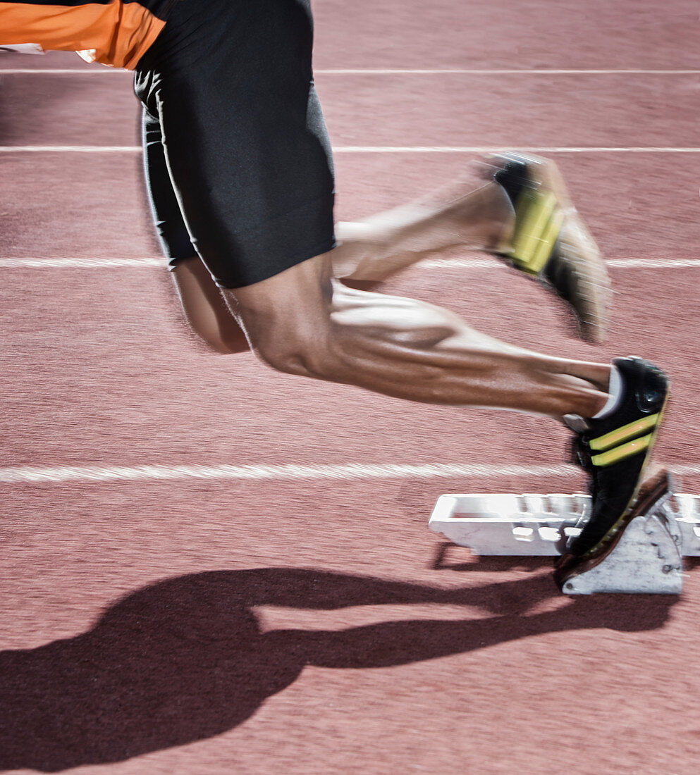 Runner taking off from starting blocks