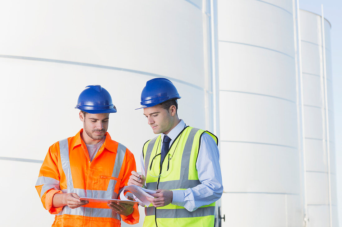 Workers reviewing paperwork nexts