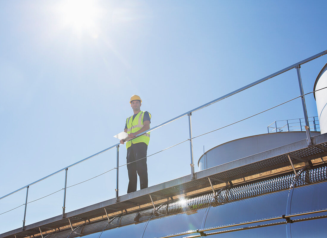 Worker on platform above milk tanker