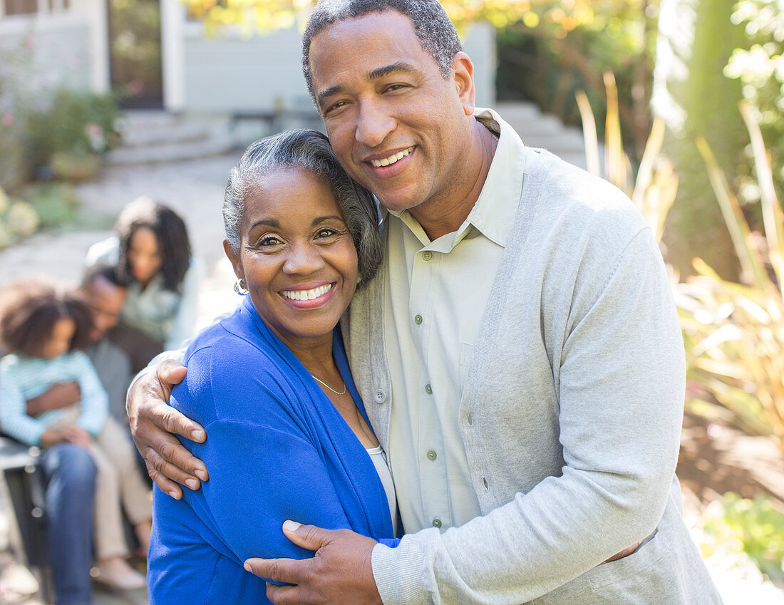 Close up Smiling senior couple hugging