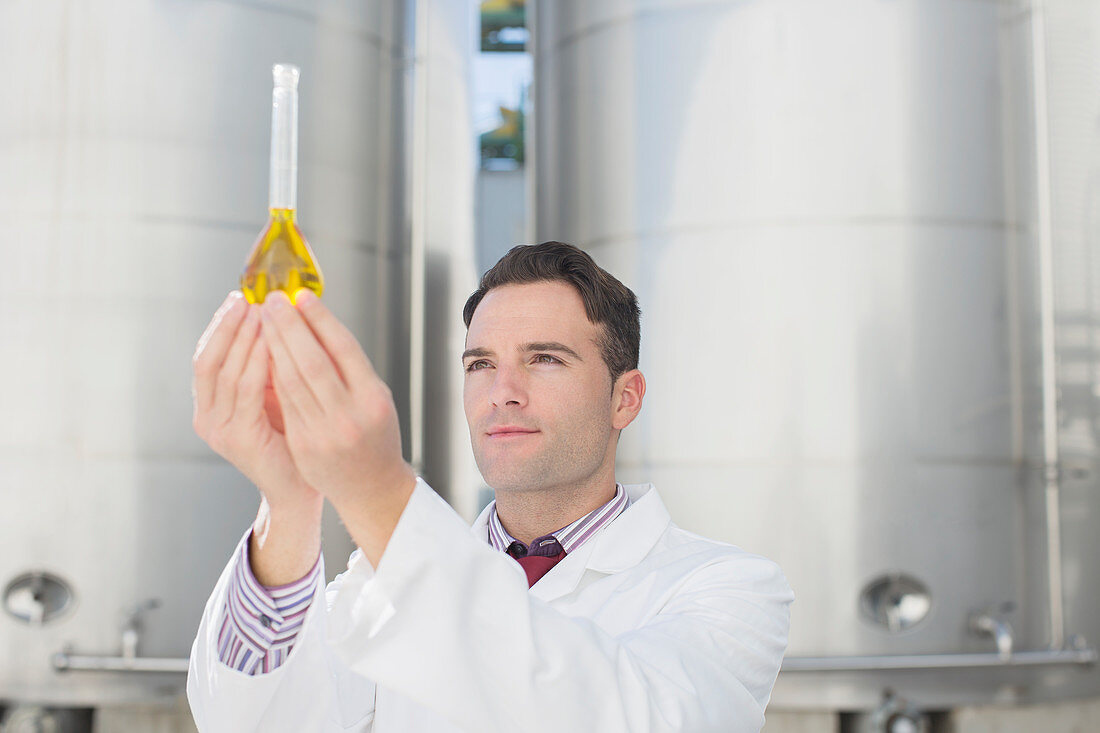 Scientist examining liquid in beaker