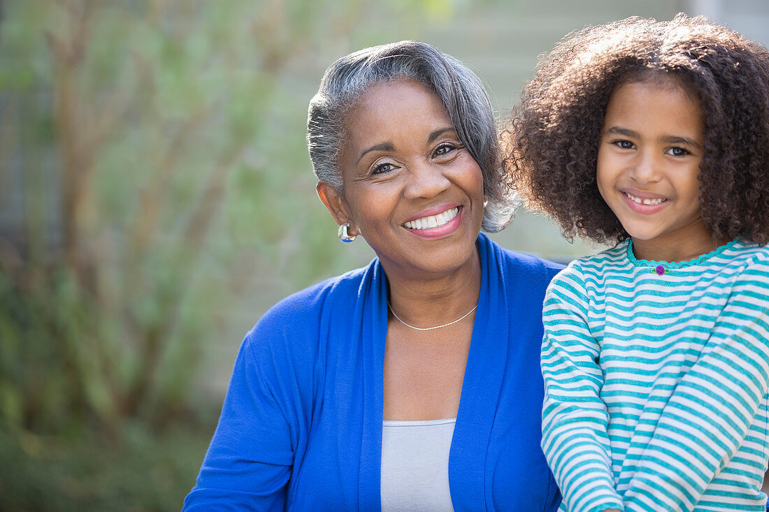 Smiling grandmother and granddaughter