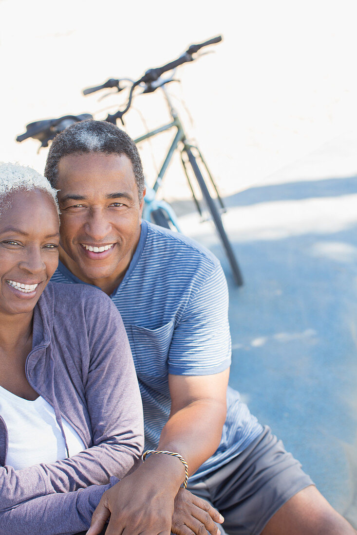 Senior couple near bicycle