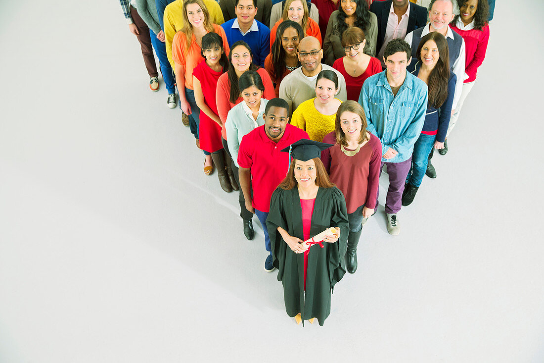 Diverse crowd behind confident graduate