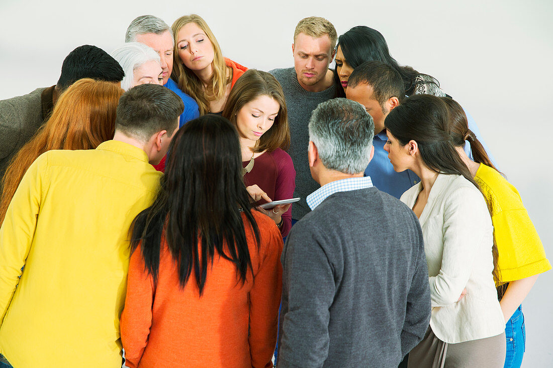 Business people around businesswoman