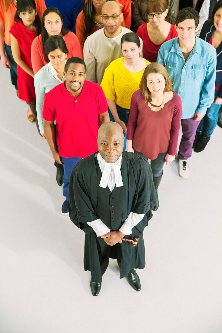 Portrait of crowd behind confident judge