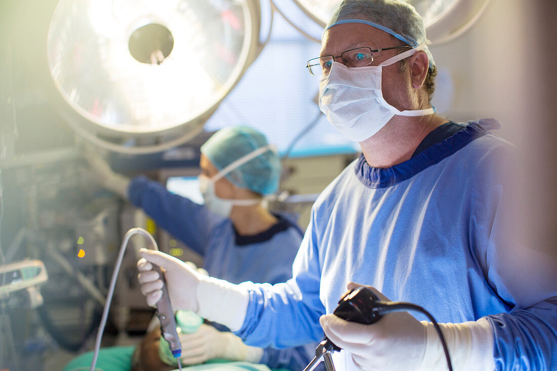 Male surgeon with laparoscopy equipment