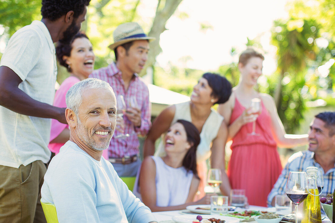 Man smiling at party outdoors