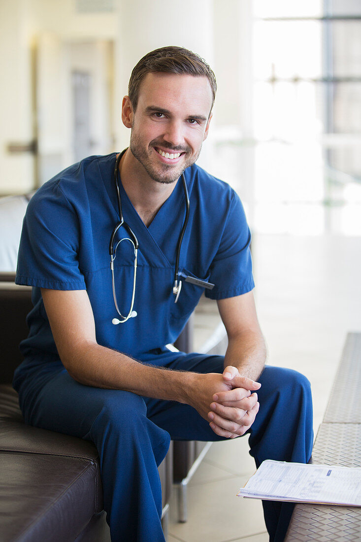 Portrait of male doctor sitting