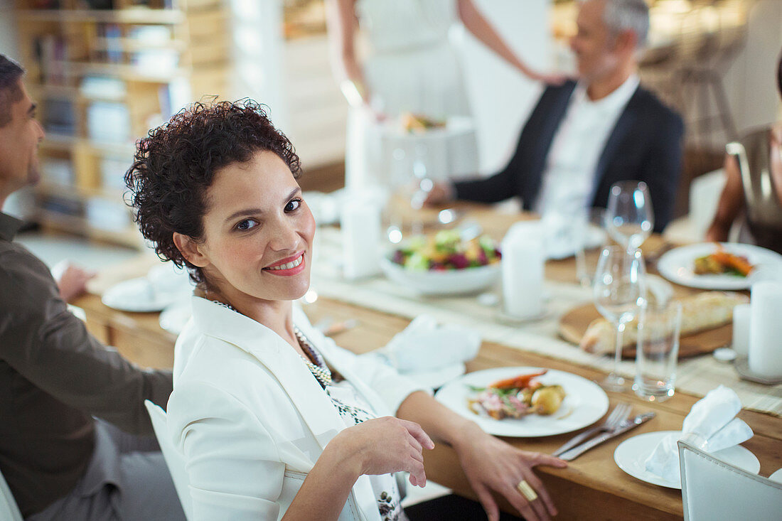 Woman smiling at dinner party