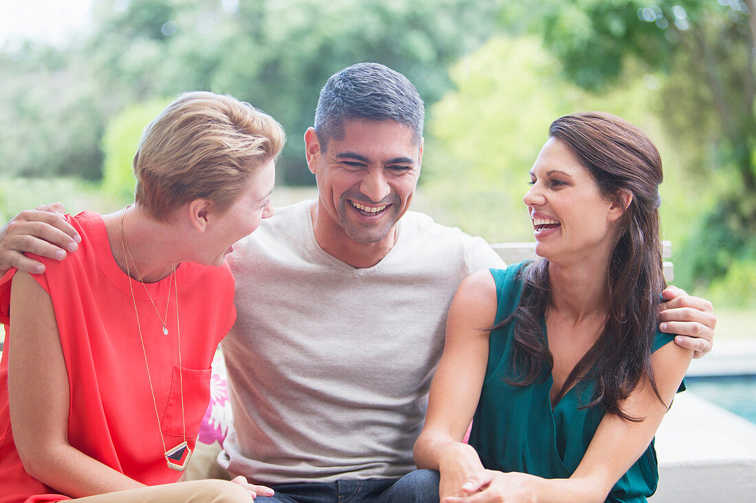 Friends relaxing together outdoors