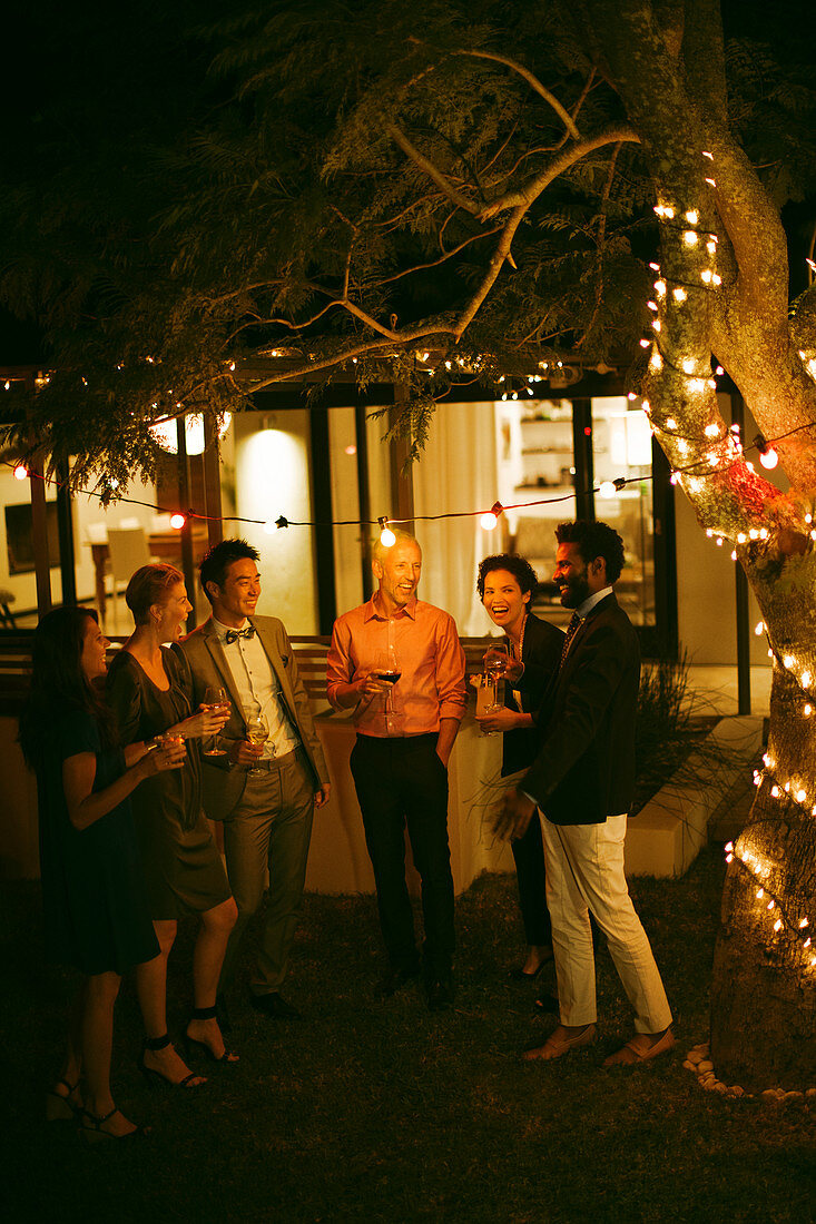 Friends talking at party