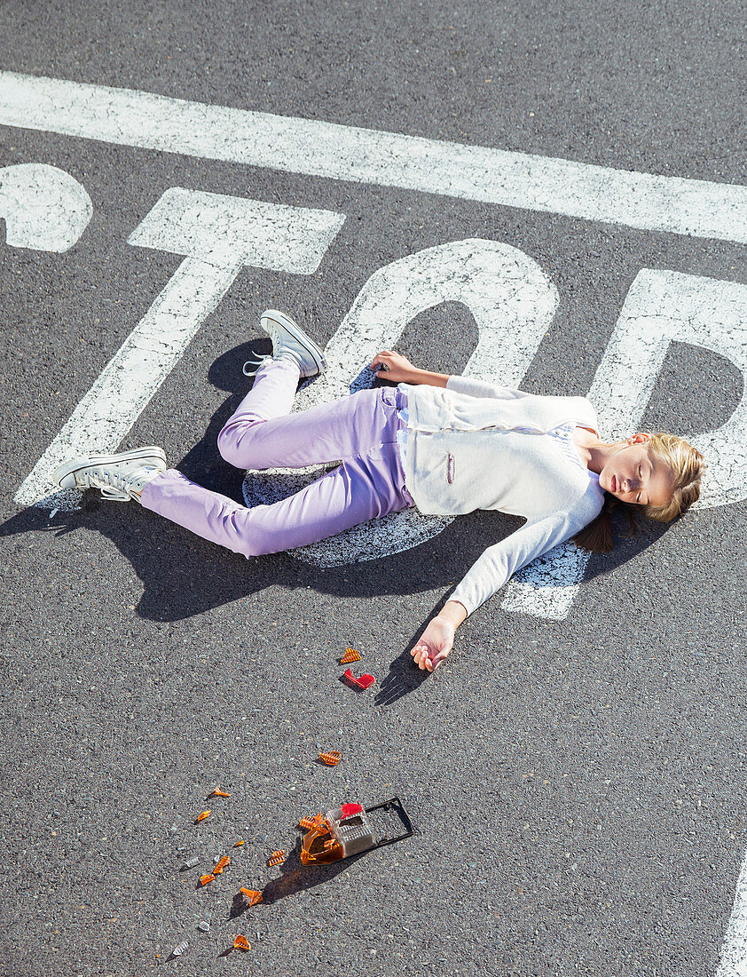 Injured girl laying in street