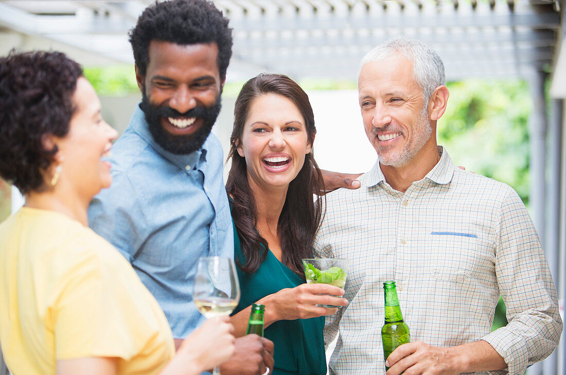 Friends laughing at party