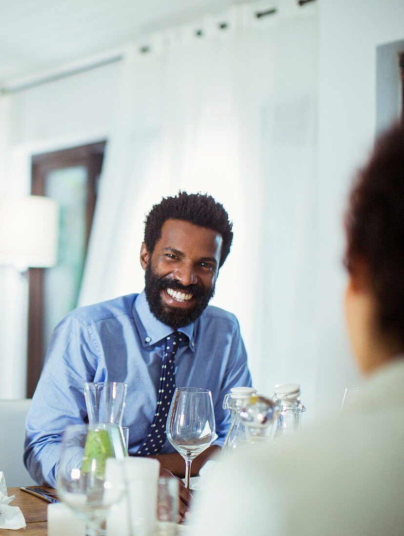 Couple eating together at table