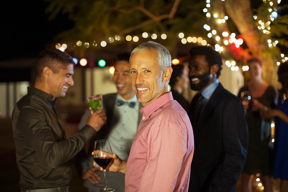 Man smiling at party