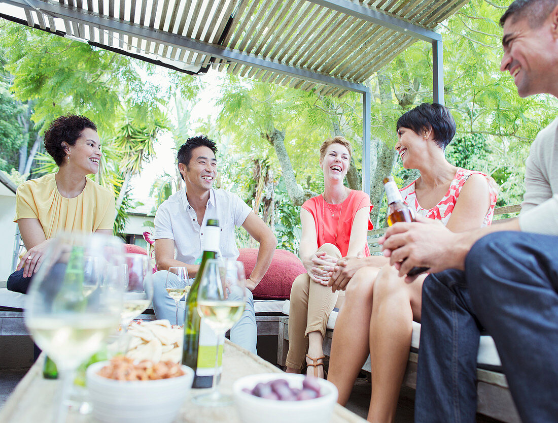 Friends talking at party