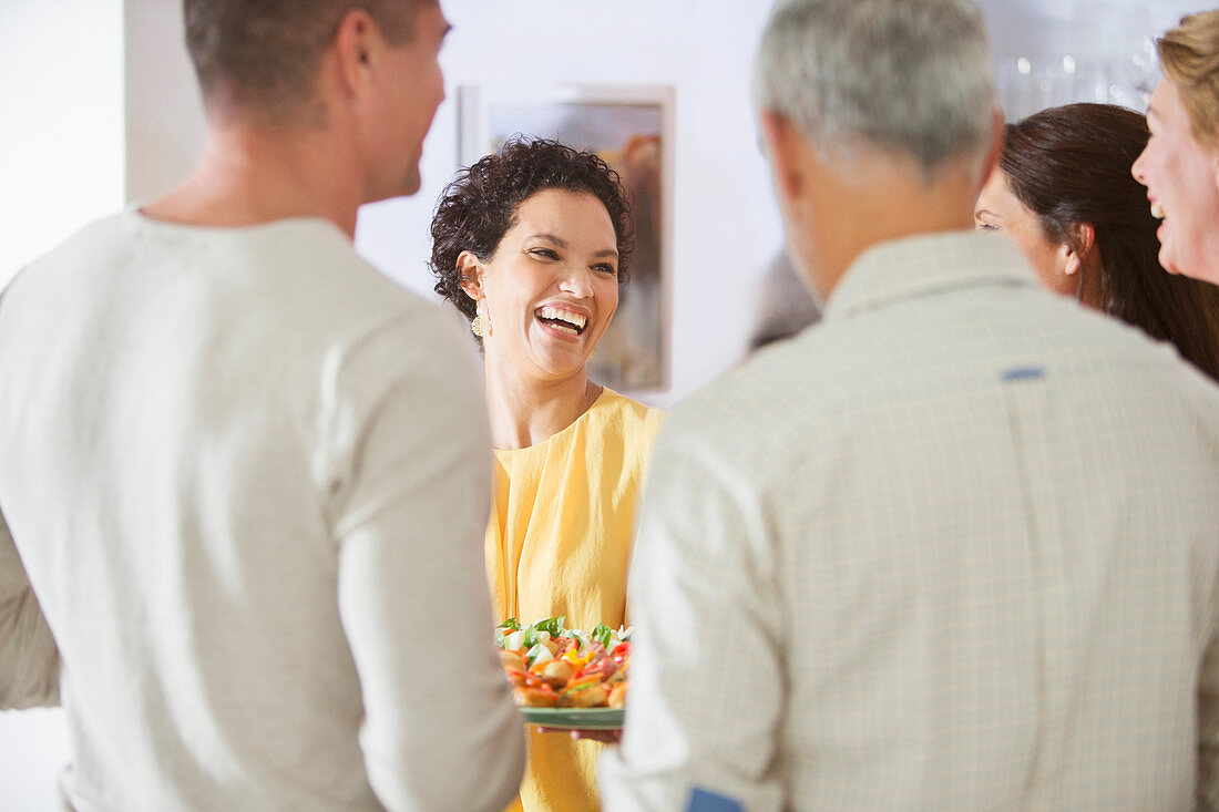 Woman laughing at party