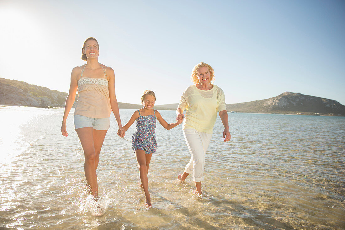 Three generations of women walking