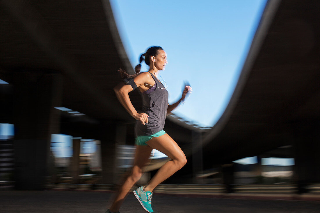 Woman running through city streets