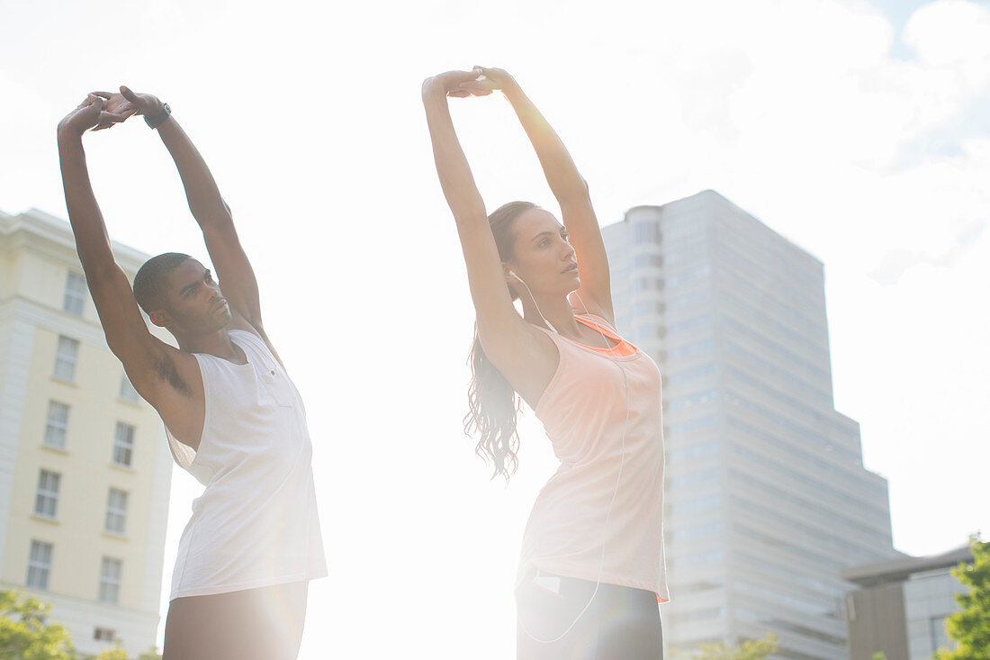 Couple stretching before exercising