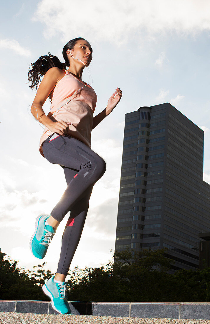 Woman exercising on city streets