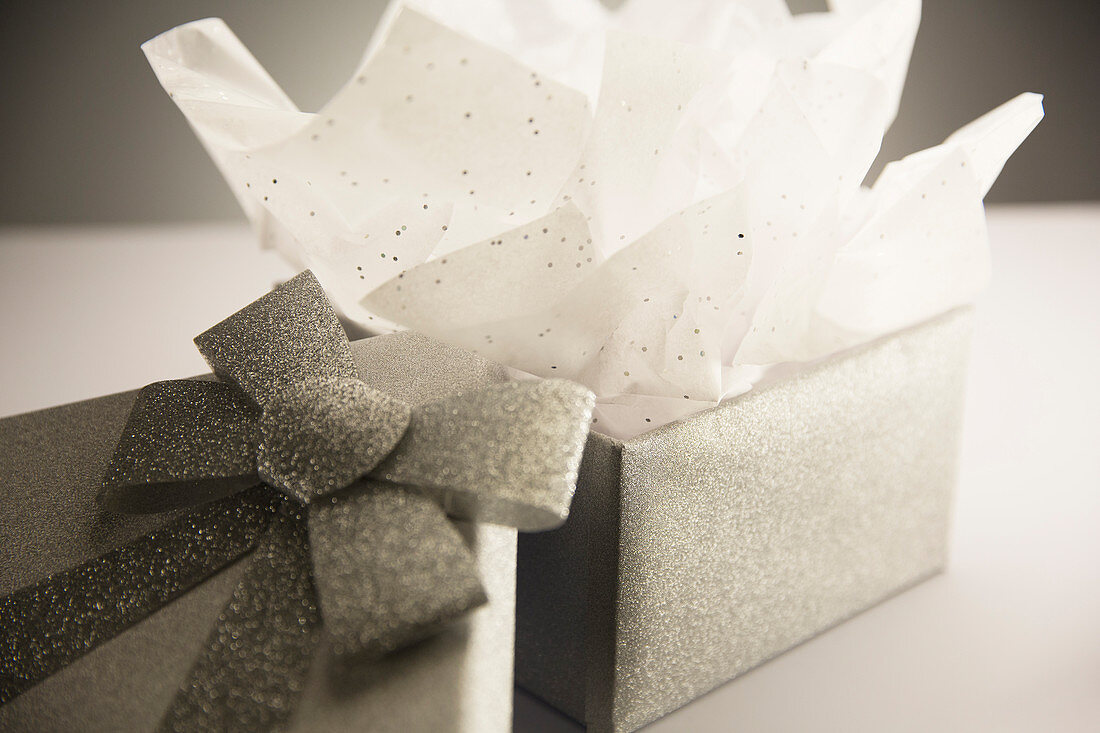 Close up of opened gift with tissue paper