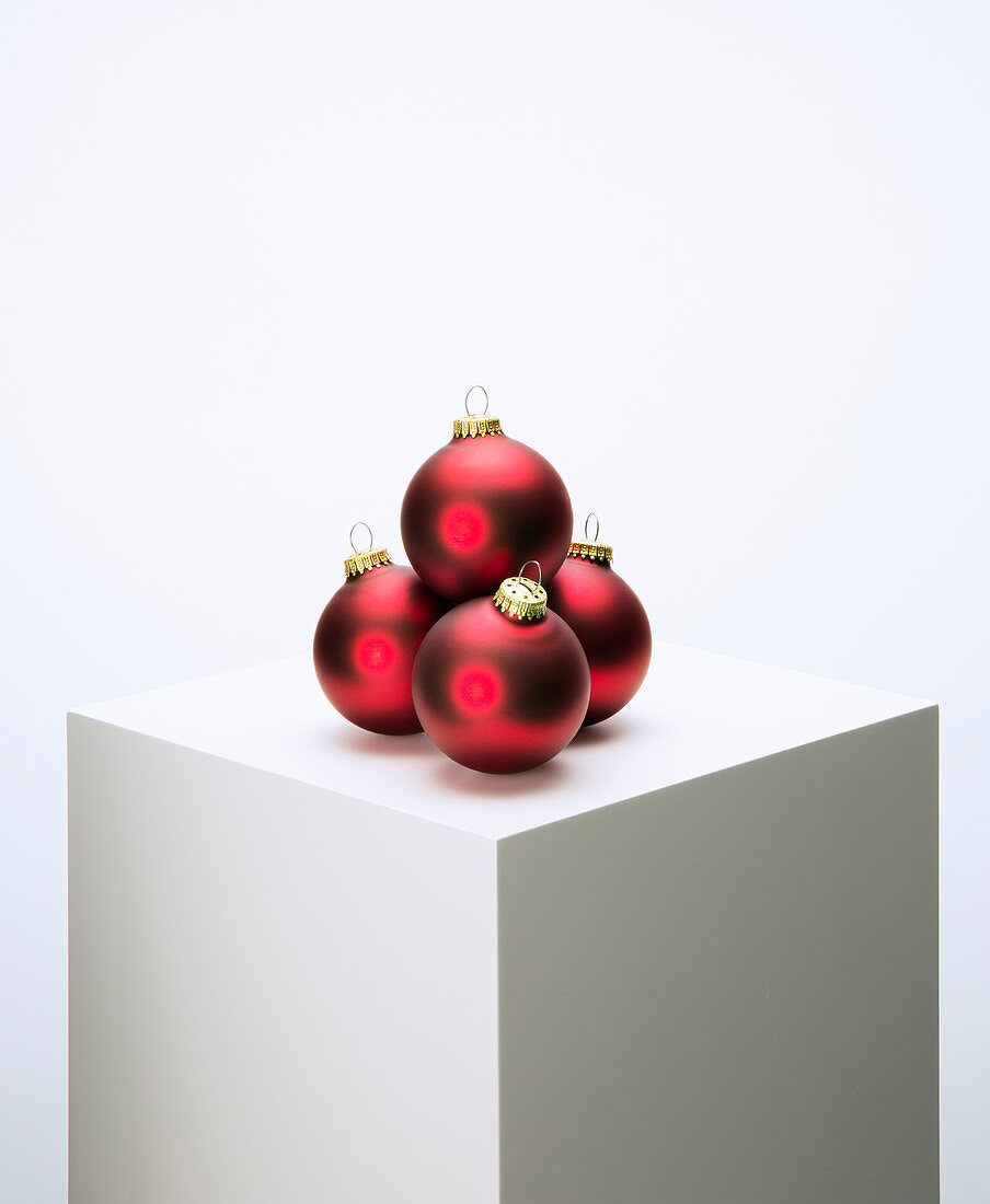 Pile of Christmas ornaments on pedestal