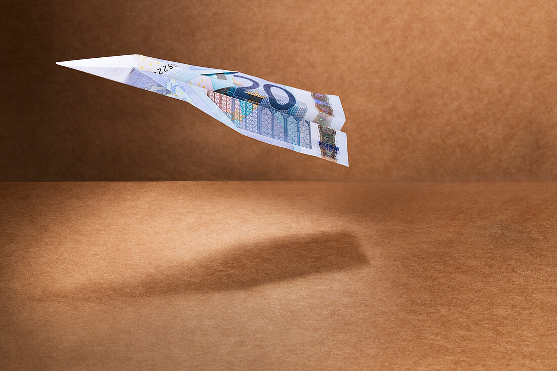 20 Euro note folded into paper airplane