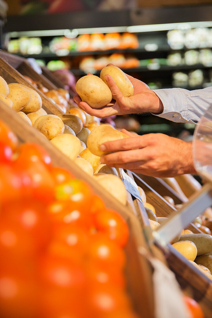 Close up of man selecting produce