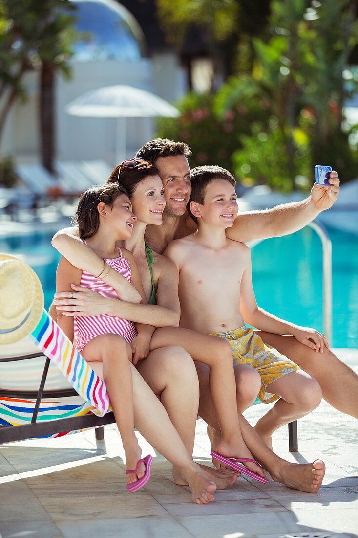 Family with two children taking selfie