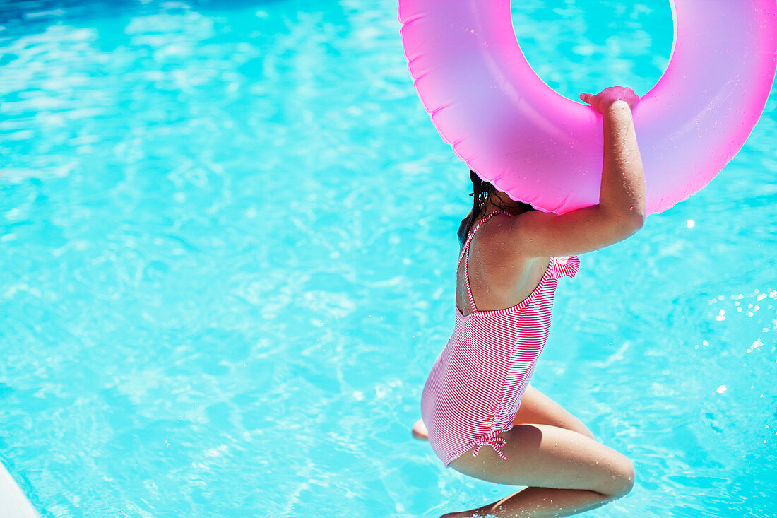 Girl with pink inflatable ring