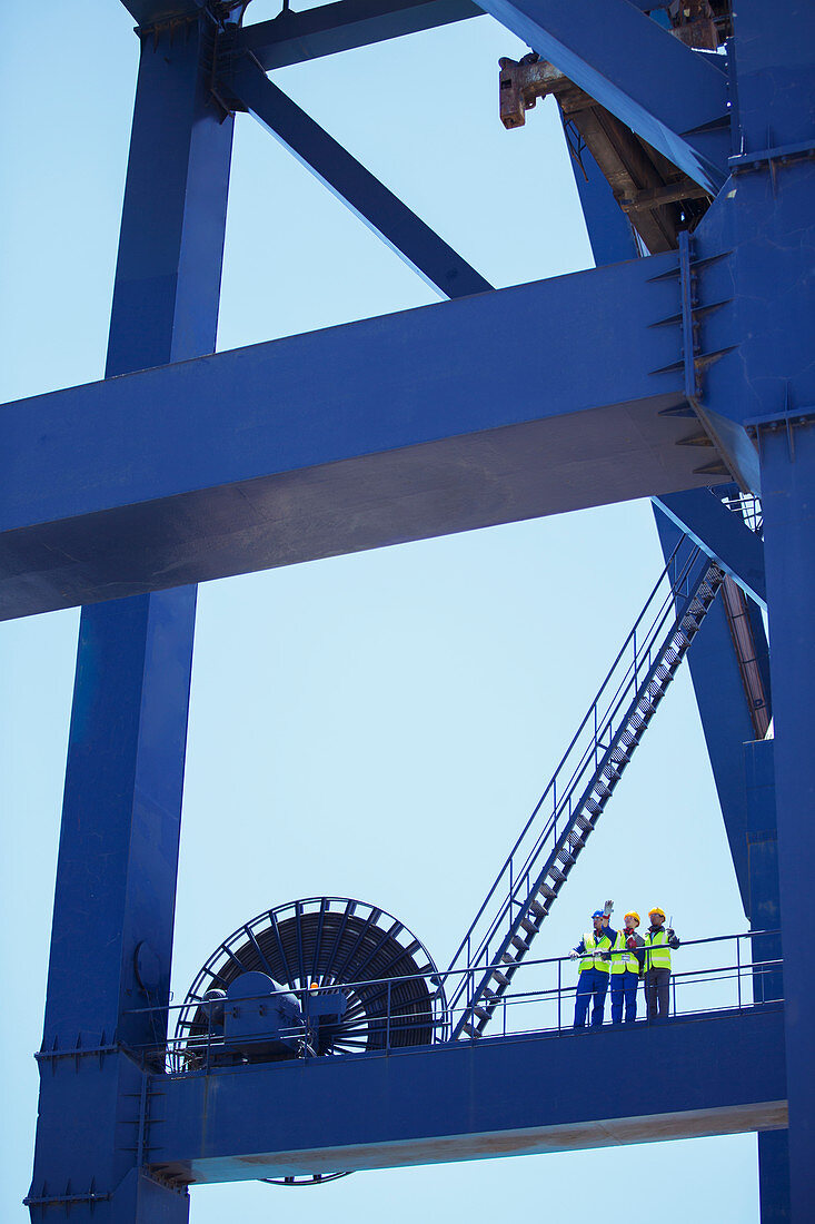 Workers standing on crane