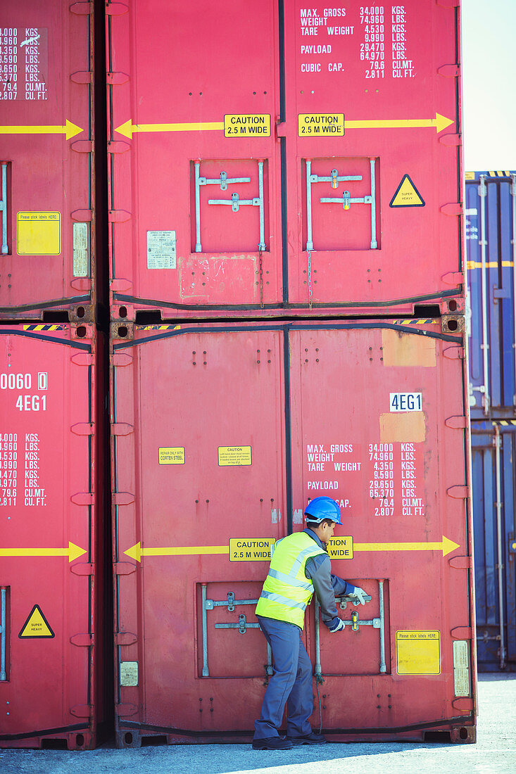Worker opening cargo container