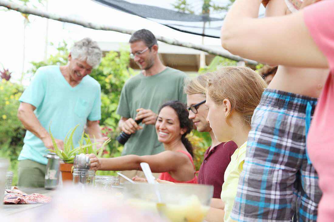 Men and women at table in garden