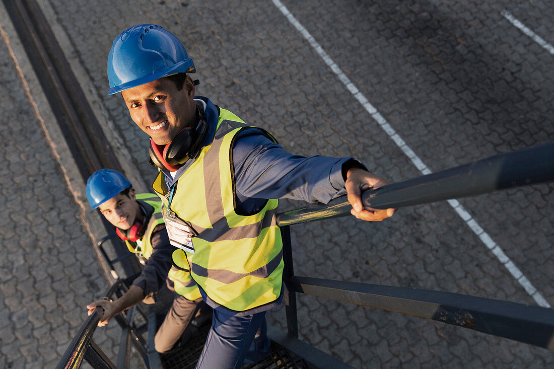 Workers standing on staircase