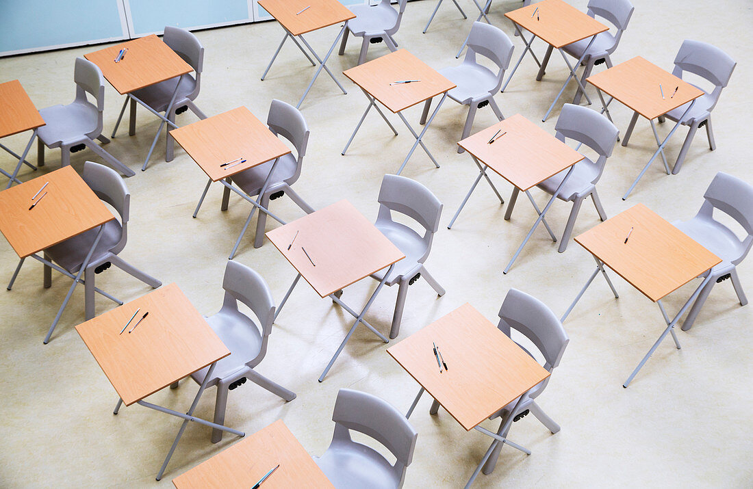 Rows of desks and chairs in classroom