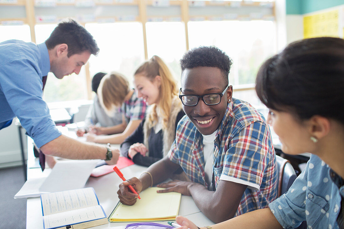 Teacher with his students in classroom