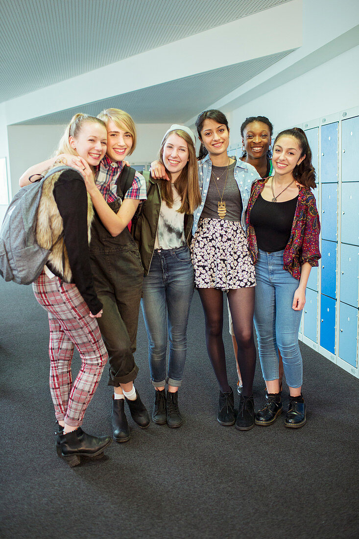 Female students standing in locker room