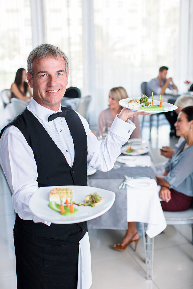 Portrait of smiling waiter