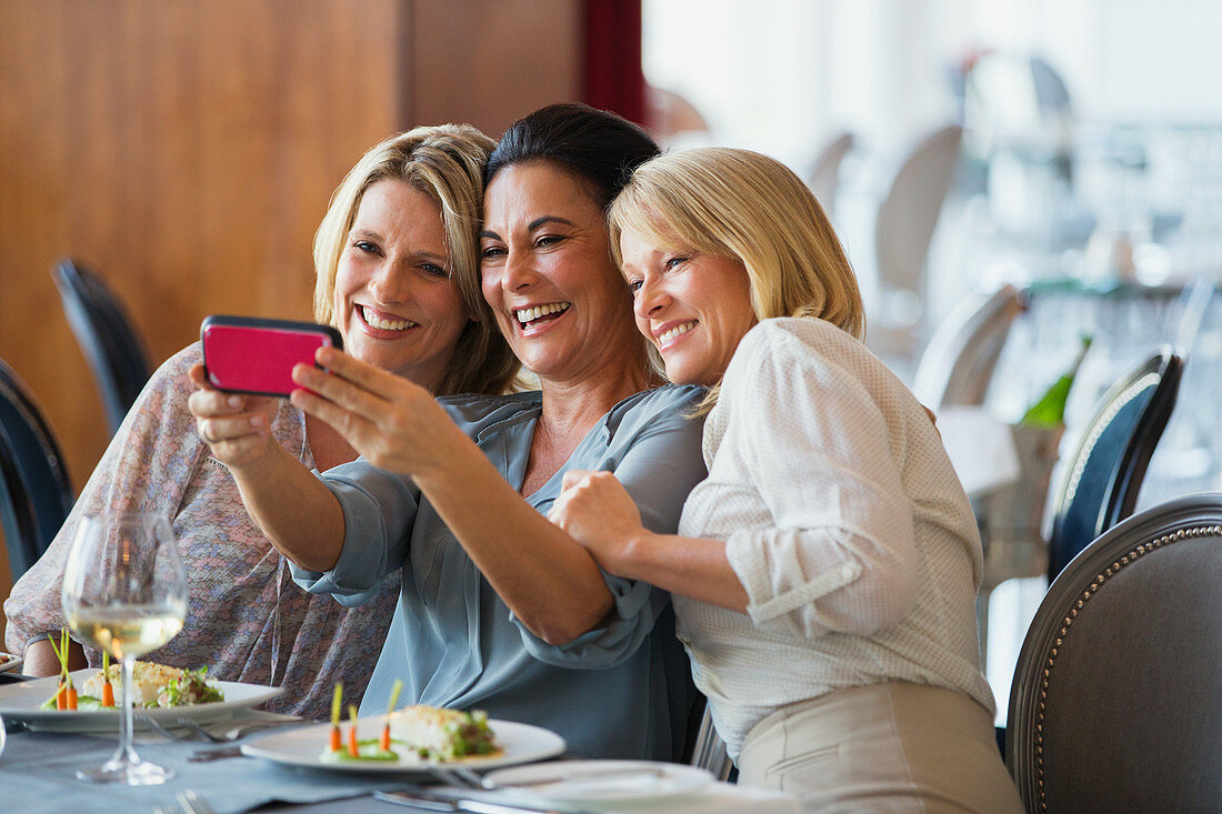 Three mature women taking selfie