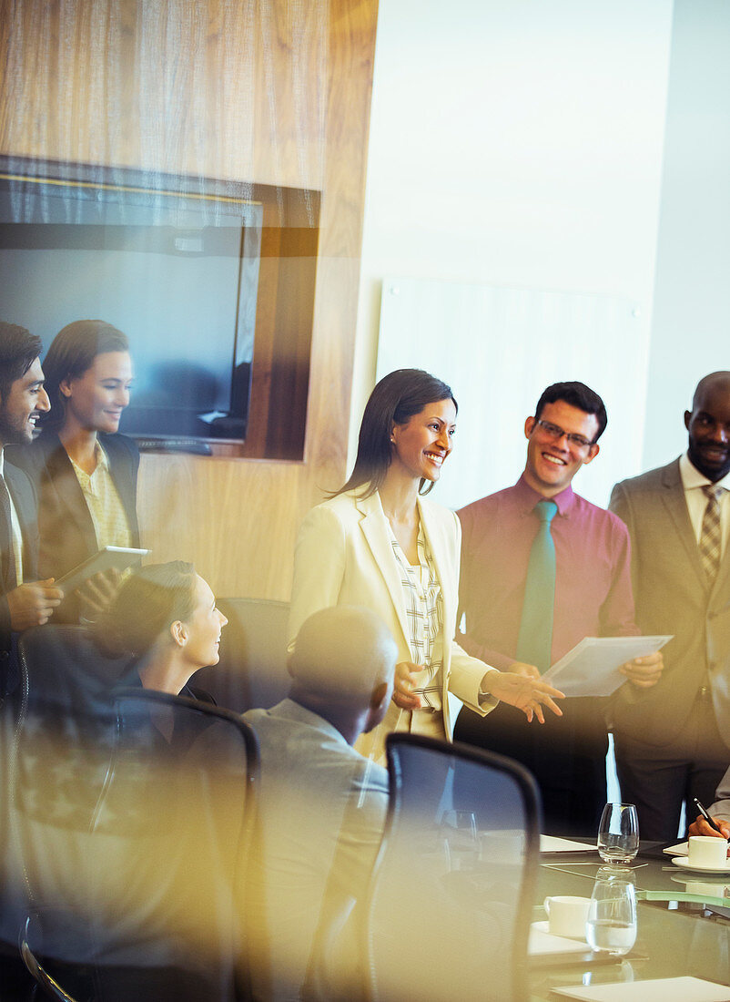 Business people smiling and discussing