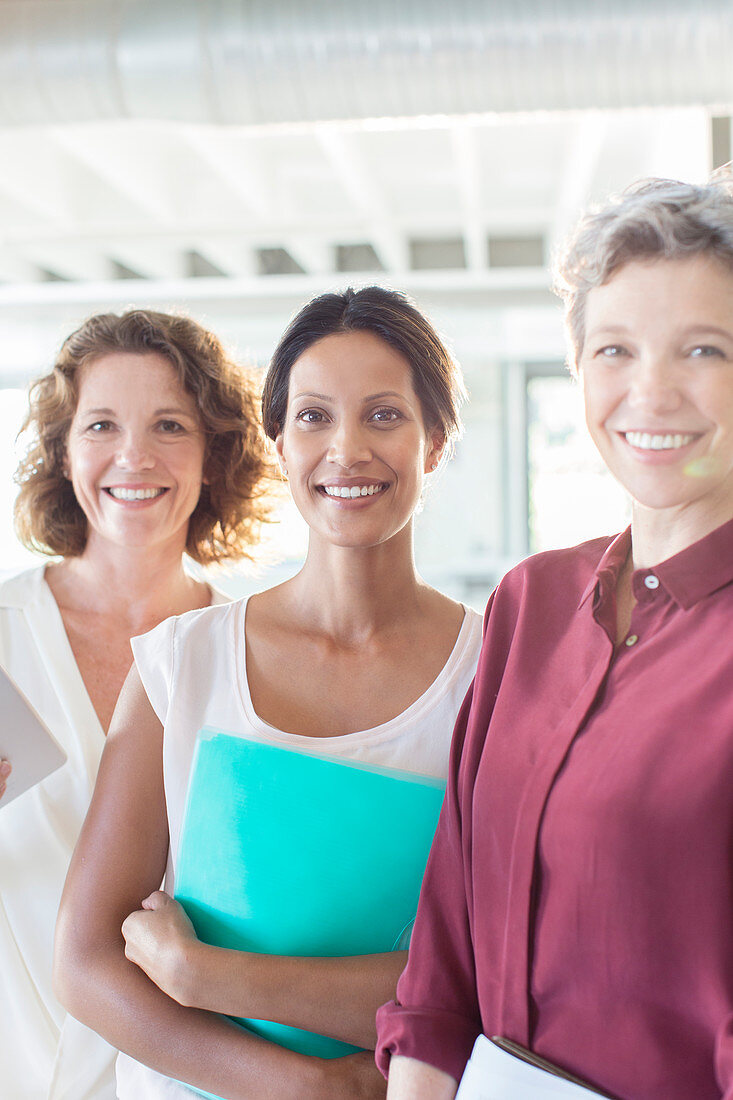 Portrait of three smiling businesswomen