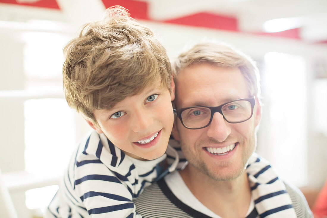 Father and son smiling