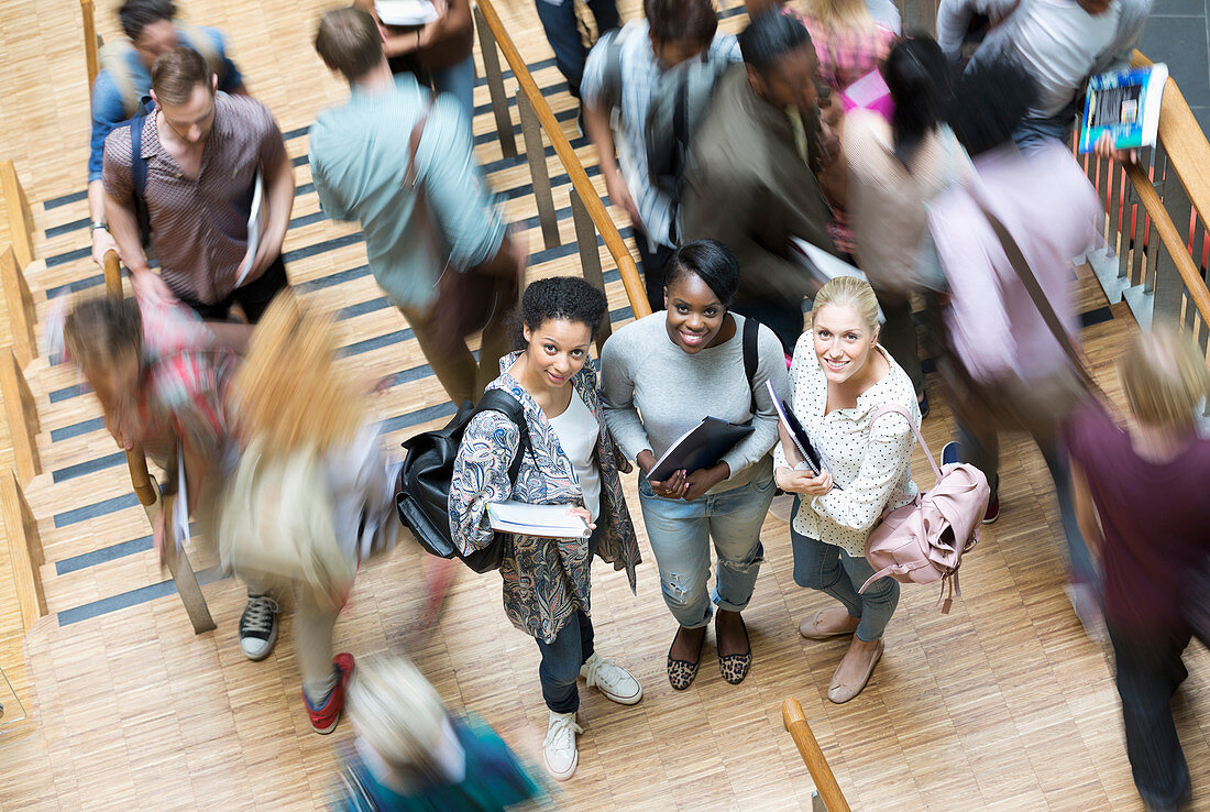 Portrait of three students at university