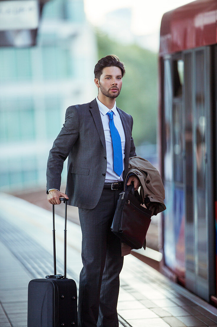 Businessman waiting at train station